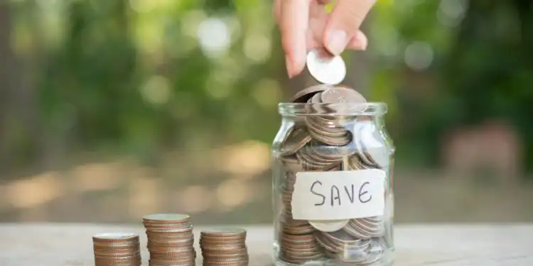 saving-money-concept-preset-by-male-hand-putting-money-coin-stack-growing-business-arrange-coins-into-heaps-with-hands-content-about-money - Pratama Institute