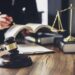 lawyer-judge-counselor-working-with-agreement-contract-courtroom (1) - Pratama Institute pph