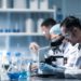 young-scientist-looking-through-microscope-laboratory-young-scientist-doing-some-research - Pratama Institute Jasa Analisis Lab