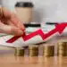 hand-holding-growth-arrow-with-coins - Pratama Institute investasi