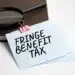 magnifying-glass-with-fringe-benefit-tax-sign-paper-sheet - Pratama Institute pajak natura