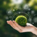 Hand of human holding green earth ESG icon for Environment Socie - Pratama Institute GCG Tangguh, ESG Tumbuh: Strategi Bisnis di Era Transisi Hijau