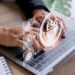 Businessman using a computer for analysis ESG environmental soci - Pratama Institute Tantangan dan Peluang ESG di Era Transparansi