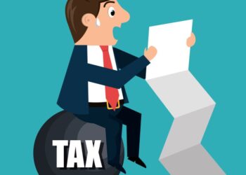 Cartoon businessman perched on a large bomb labeled 'TAX' while reading a document, symbolizing a tax burden stress test.