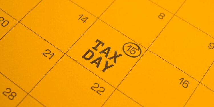 Calendar page highlighting TAX DAY on the 15th with a circled 15 mark in a yellow page theme.